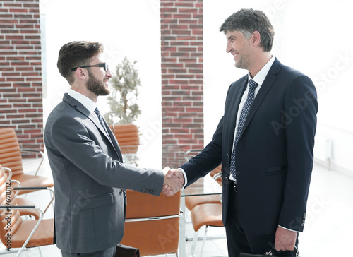 Handshake of a businessman and a lawyer in the office photo