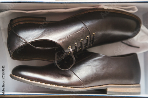Pair of men's shoes in shoebox photo