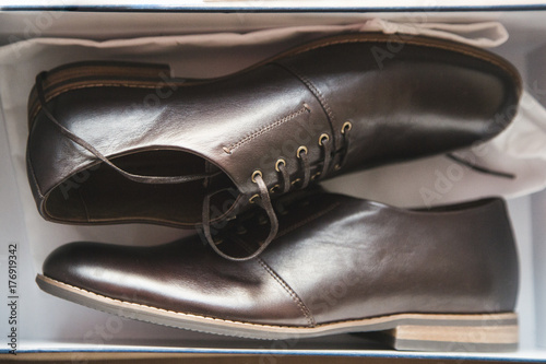 Pair of men's shoes in shoebox