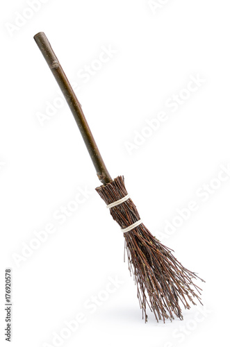 Witch's magic broom isolated on white background photo