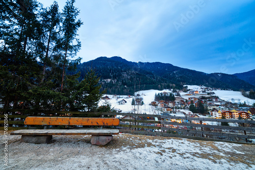 sunset on bench in alpine village
