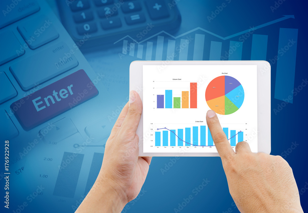 hands of a man holding graph business tablet device on keyboard, graph abstract background hands of a man holding graph business tablet device on keyboard, graph abstract background