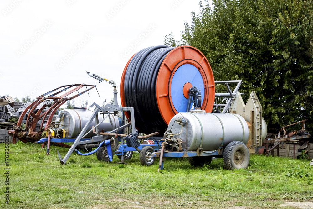 custom made wallpaper toronto digitalTrailers with fertilizer tanks and a drum with a watering hose.