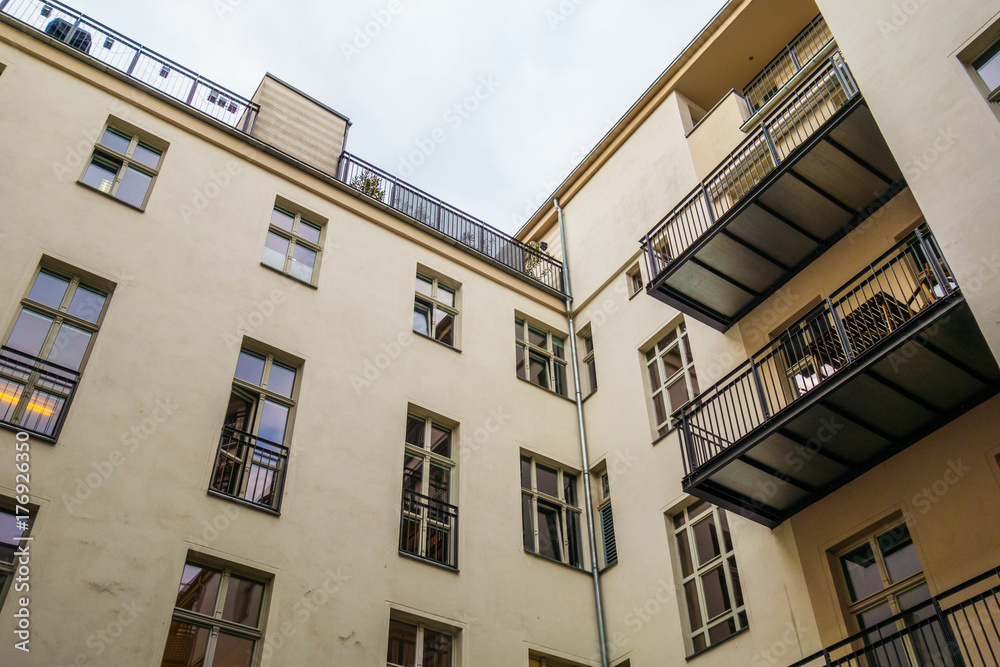 Naklejka premium yellow apartment house in low angle view