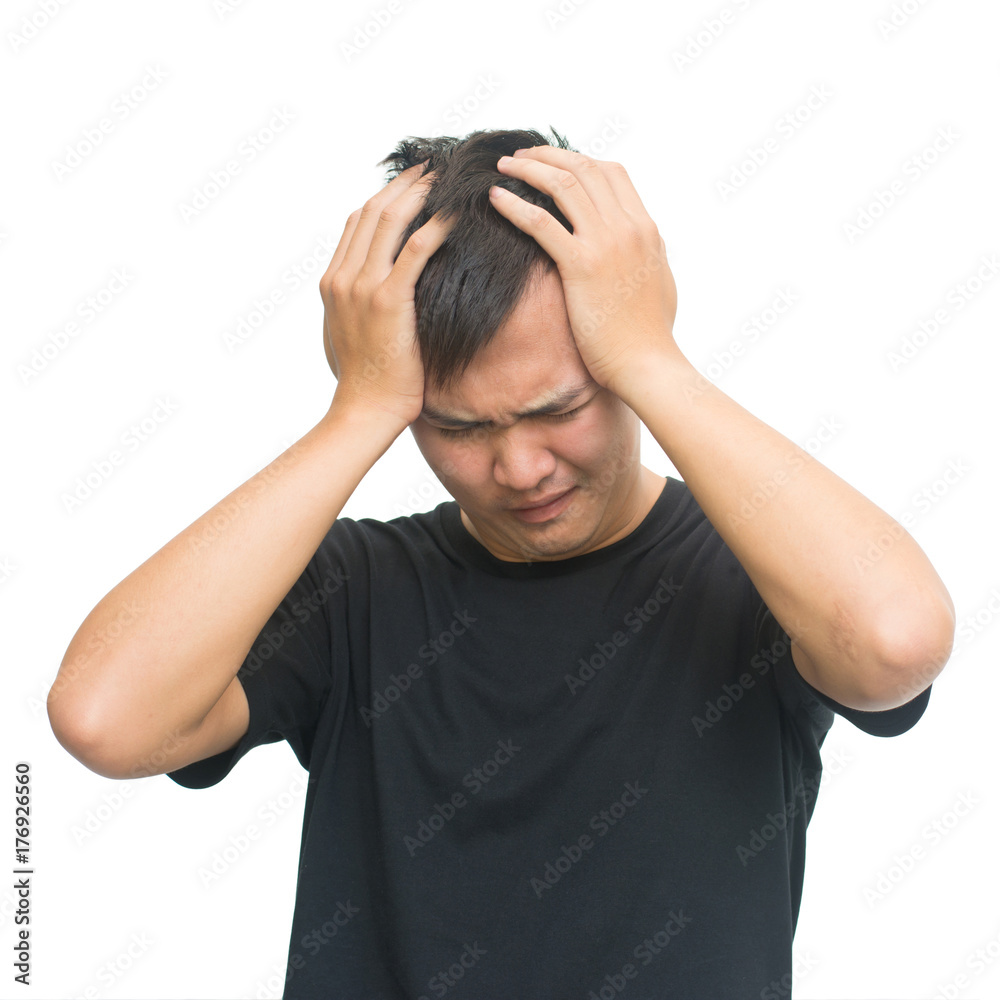 Frustrated young man with a headache - Isolated on white background with clipping path Frustrated young man with a headache - Isolated on white background with clipping path