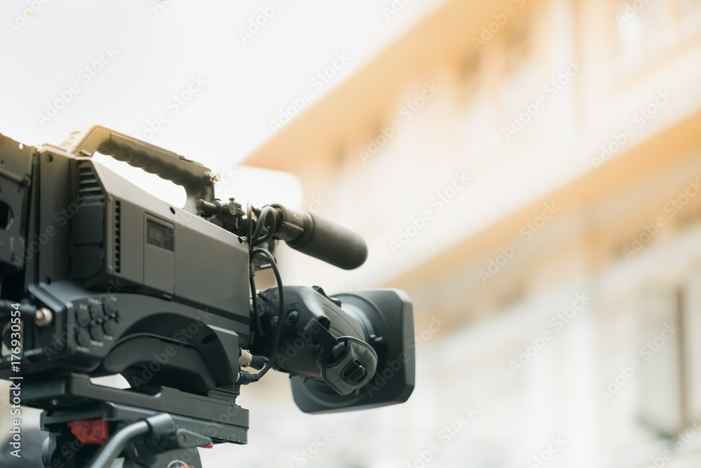 Video camera covering an event for News conference. Spokesman. Video camera covering an event for News conference. Spokesman.