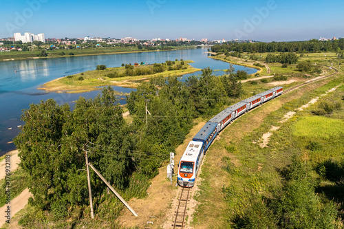 The train travels along the Children's Railway on the Konny island in the Irkutsk city photo