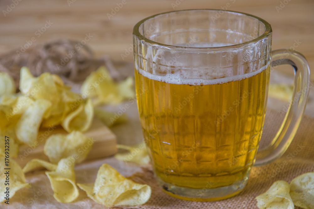 Beer and chips on the table. Octoberfest theme Beer and chips on the table. Octoberfest theme