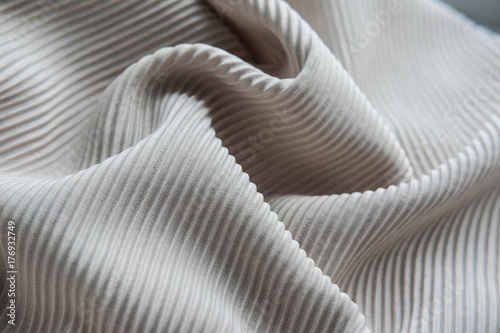 The fabric is laid out waves. Black and white canvas material textiles.
