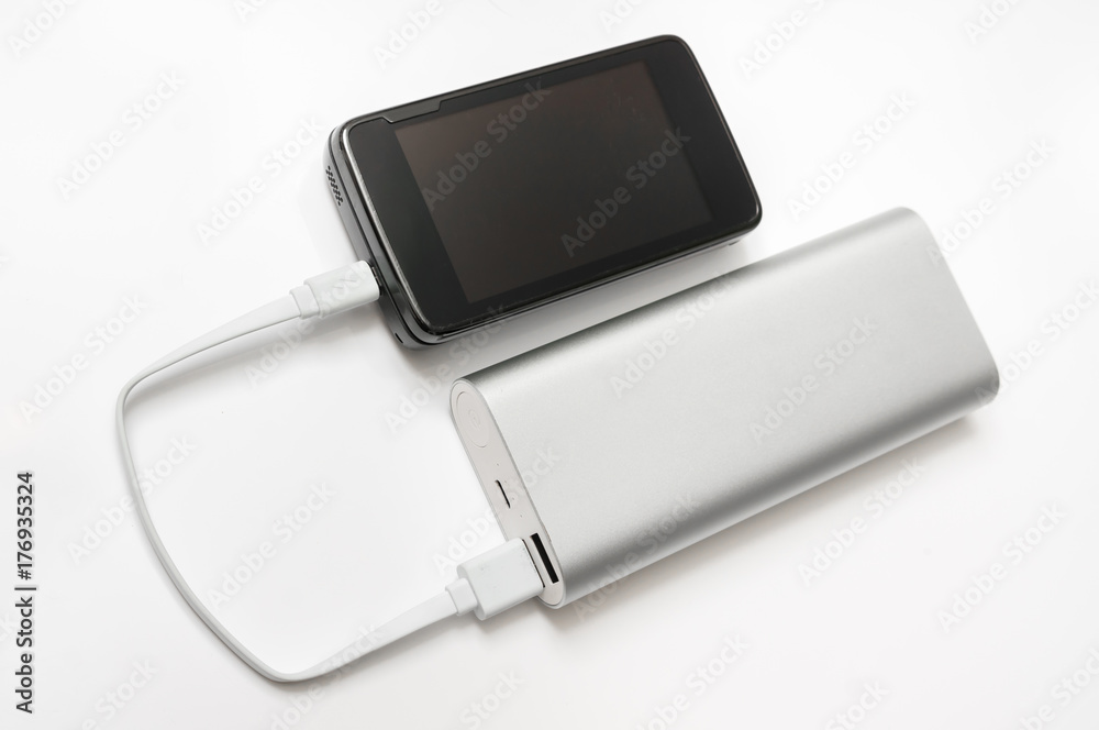 Charging smartphone from white power bank Charging smartphone from white power bank