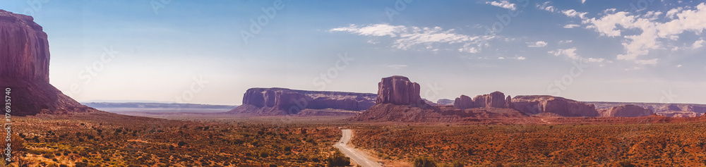 Road among the rock-monuments in the Valley of Monuments, Utah. Natural Attractions of North America