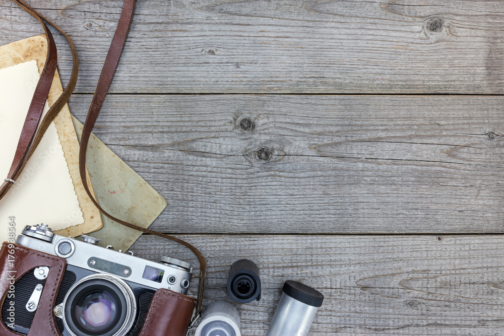retro still camera and empty instant paper on wooden background flat view retro still camera and empty instant paper on wooden background flat view