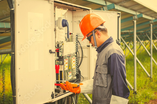 operation and maintenance in solar power plant ; engineer working on checking and maintenance in solar power plant ,solar power plant to innovation of green energy for life
