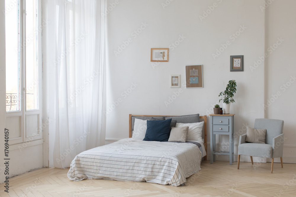 Fototapeta premium Interior of white and gray cozy bedroom