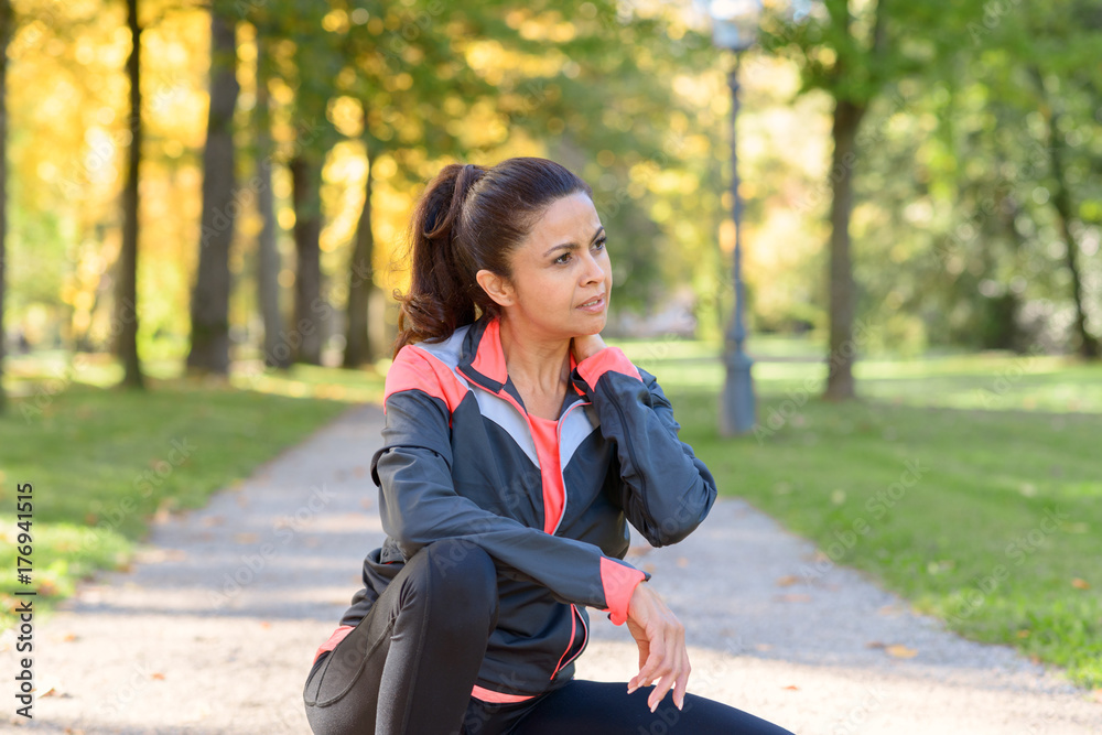 Athletic woman taking a break from a workout Athletic woman taking a break from a workout