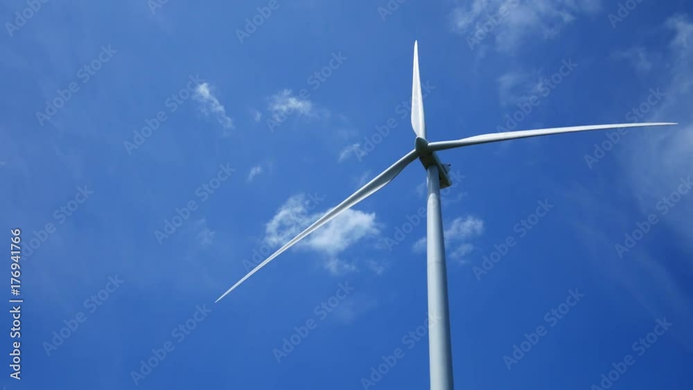 A wind farm and wind turbines for electricity generation on sunny day with blue sky in Thailand
A wind farm and wind turbines for electricity generation on sunny day with blue sky in Thailand