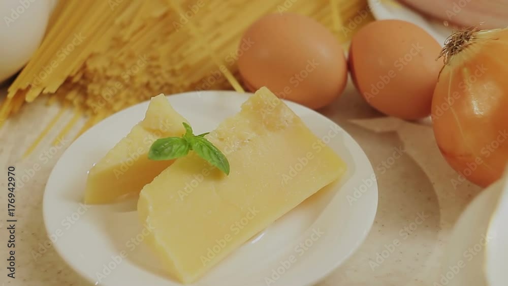 Closeup of the ingredients for pasta cooking lie on the countertop Closeup of the ingredients for pasta cooking lie on the countertop