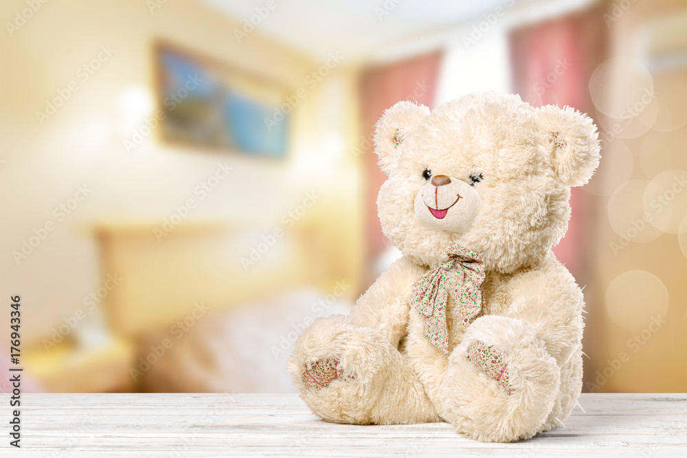 Obraz premium Teddy Bear toy alone on wood