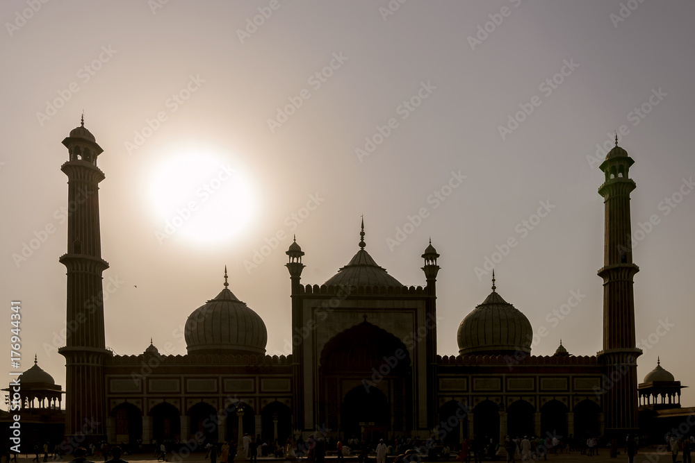 The sun is shining behind the Jama Masjid, Friday's Mosque, New Delhi, India