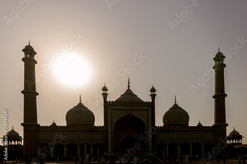 The sun is shining behind the Jama Masjid, Friday's Mosque, New Delhi, India