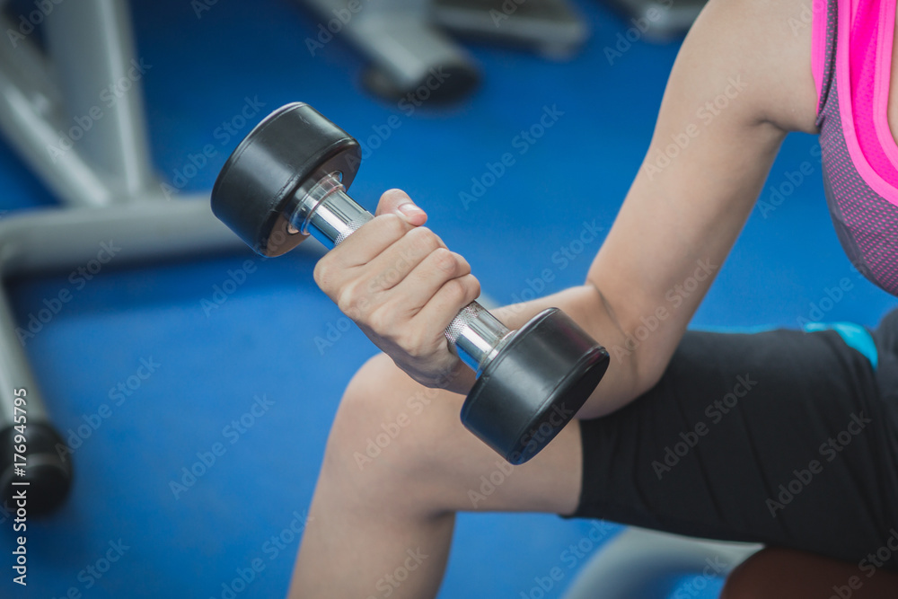 fitness people doing exercises and building muscle at gym ; healthy lifestyle fitness people doing exercises and building muscle at gym ; healthy lifestyle