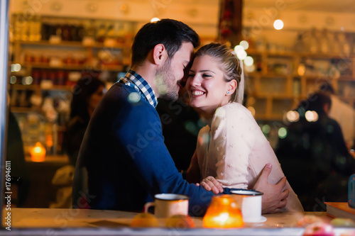 Young attractive couple on date in bar