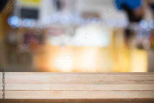 Table wooden desk empty with night bokeh in background for present product. © Prathankarnpap