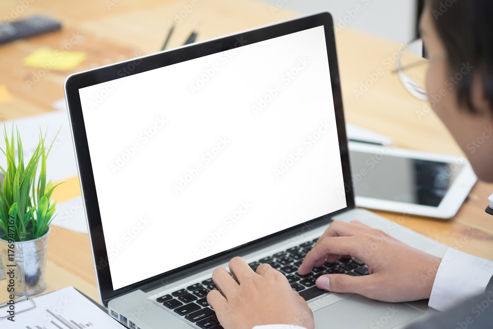 Businessman using laptop with empty screen. Businessman using laptop with empty screen.