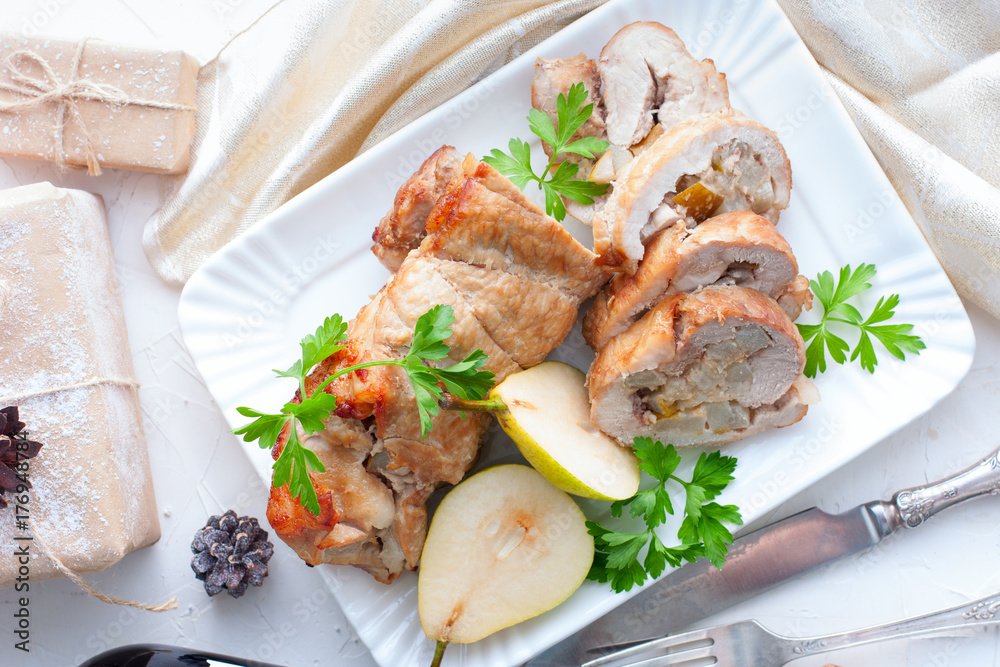Meatloaf with pear on festive table, horizontal Meatloaf with pear on festive table, horizontal