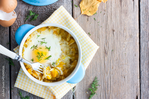 Autumn version of dietary dinner: pumpkin with egg, top view, copy space photo