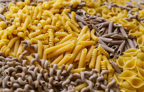 noodles  pasta of different kinds  scattered on the table.