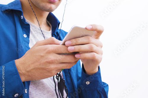 hands in the foreground with the mobile phone on white background