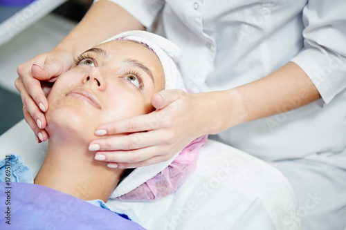 A cosmetic procedure, the girl's face closeup