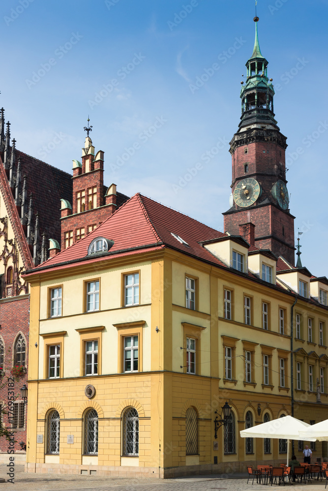 Beautiful old building on Wroclaw Old Town against blue summer sky, Poland, Lower Silesia