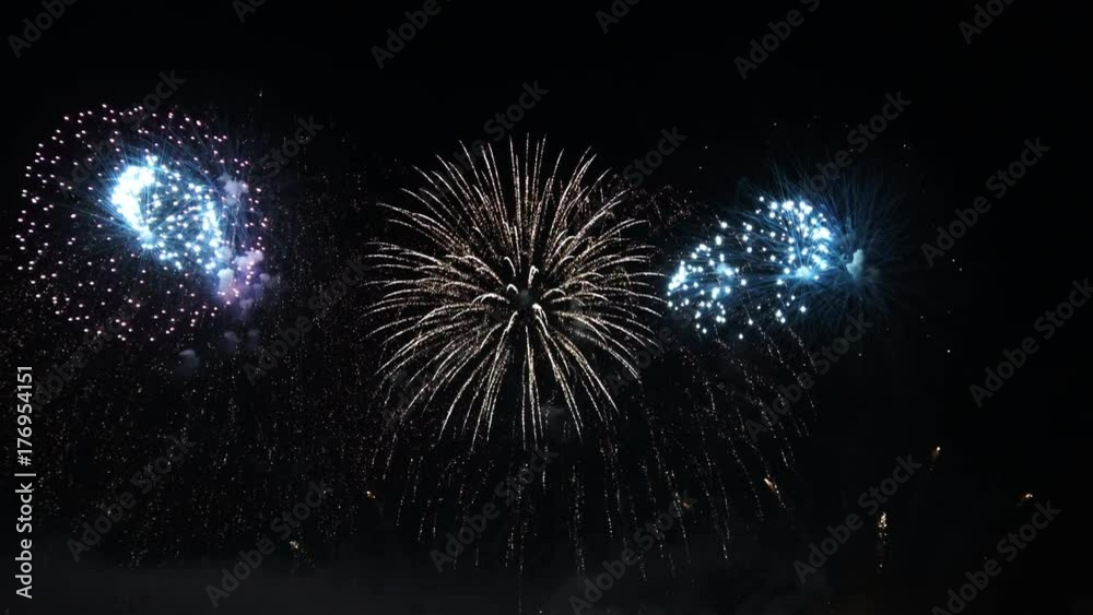 4K video footage of colorful bright pyrotechnic show, flashes of salute firework of different colors close up view