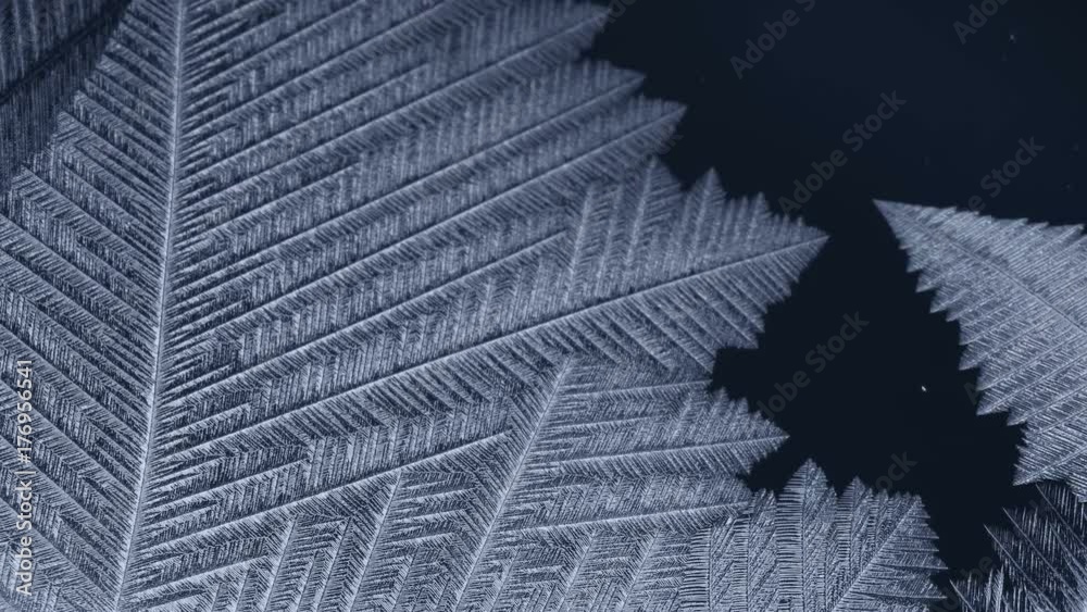 Freezing window close-up, winter holidays background,