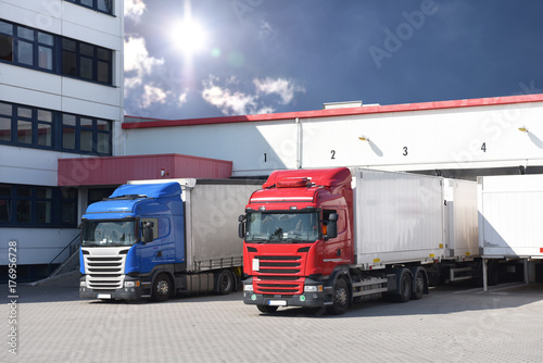 Trucks are loaded with freight at the depot // LKW´s werden am Depot mit Fracht beladen photo