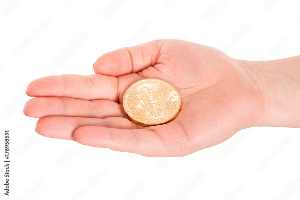 Golden Bitcoin in a man hand. Digitall symbol of a new virtual currency. Golden Bitcoin in a man hand. Digitall symbol of a new virtual currency.