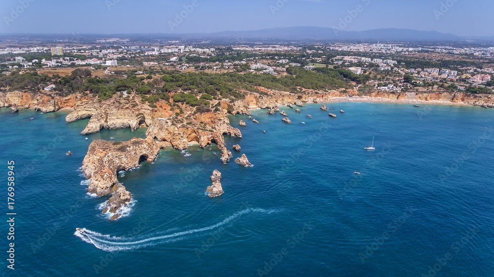 Aerial. View from the sky of coast of Portimao. Beaches Submarino, and praia Joao de Arens.