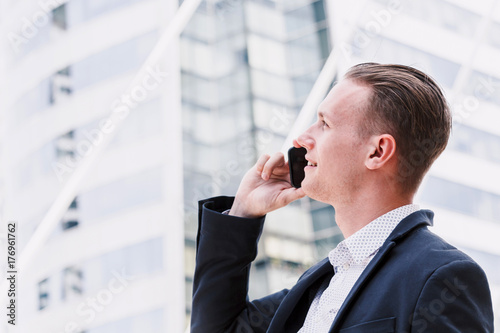 Handsome businessman using his smartphone