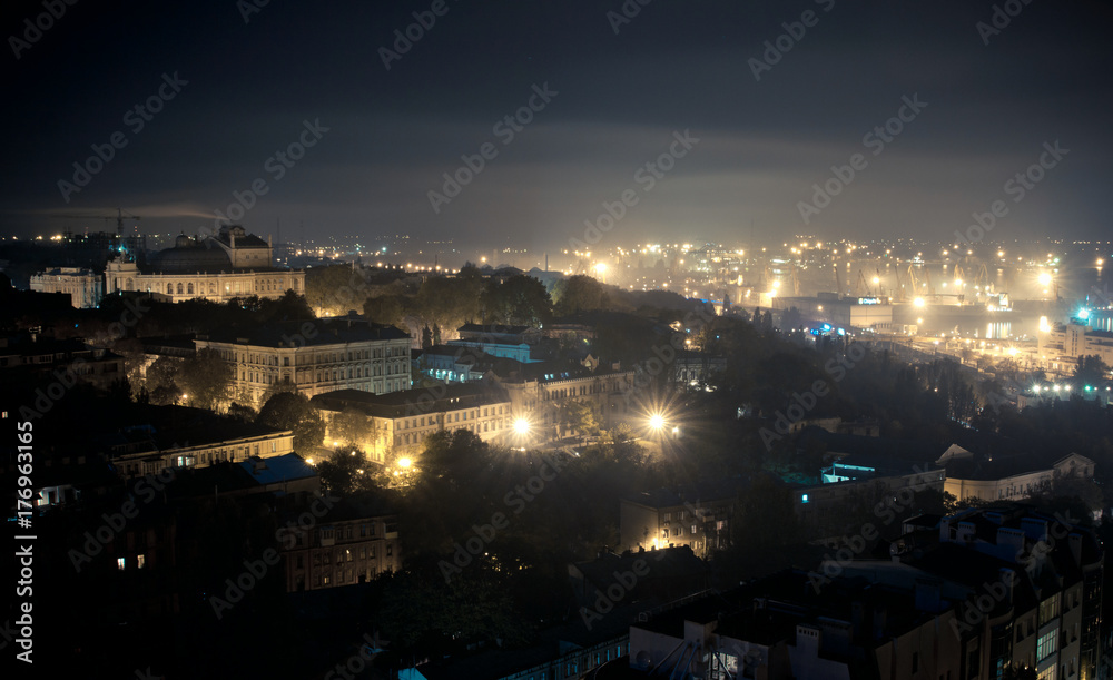 aerial view of Odessa , Ukraine.  Roofs, port and sea at night