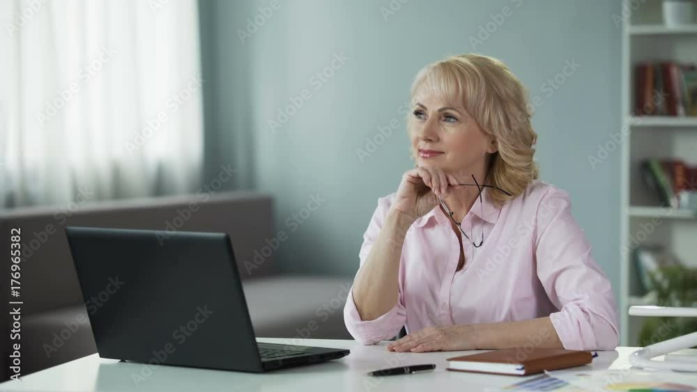 Female cosmetics consultant considering how to improve sales in internet Female cosmetics consultant considering how to improve sales in internet