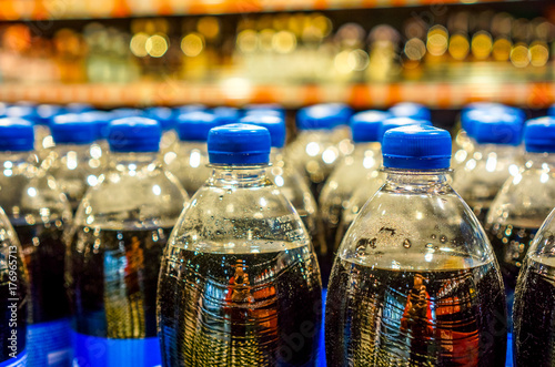 Many bottles with pepsi top view. background made by big pepsi bottles photo