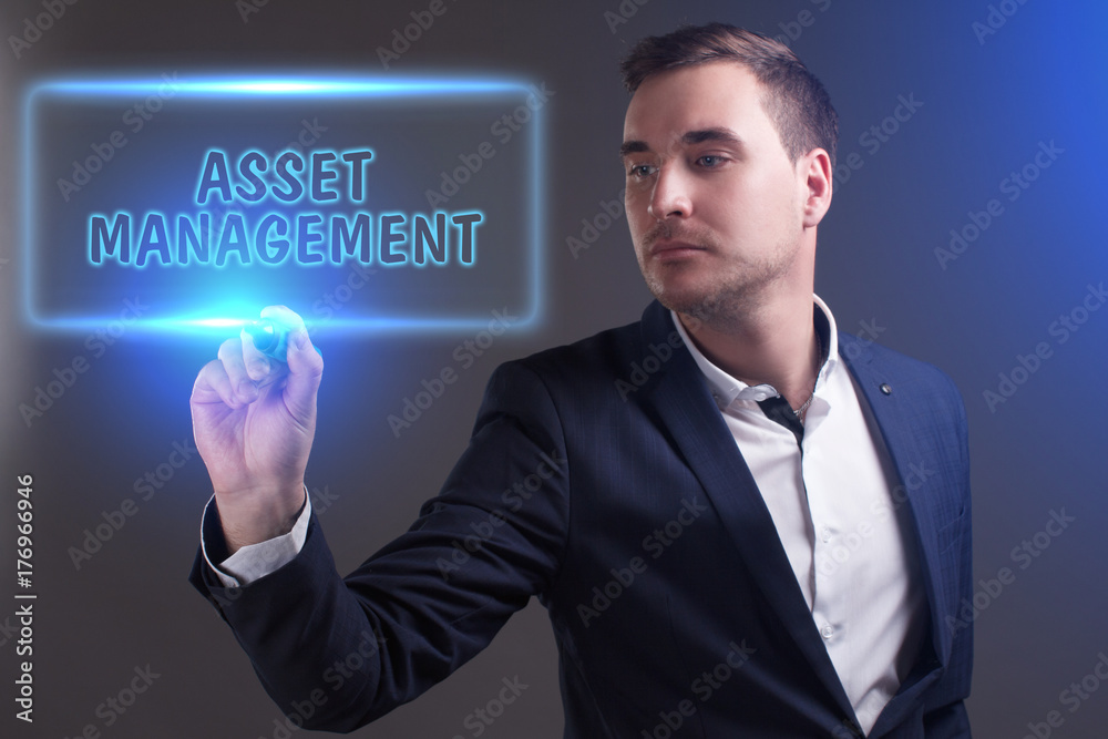 The concept of business, technology, the Internet and the network. Young businessman showing inscription: Asset management