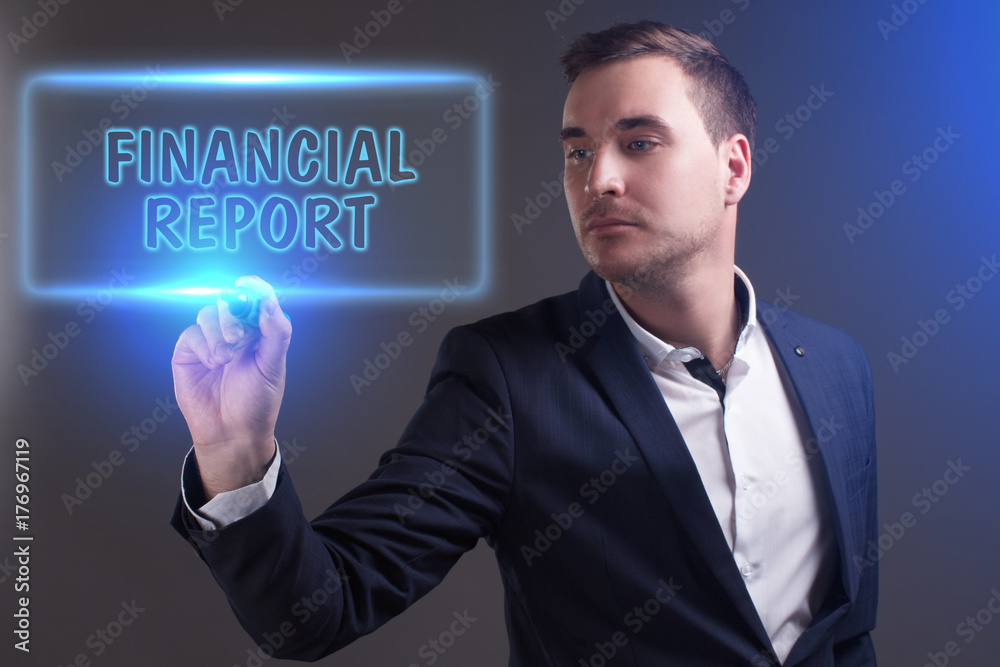 The concept of business, technology, the Internet and the network. Young businessman showing inscription: Financial report The concept of business, technology, the Internet and the network. Young businessman showing inscription: Financial report