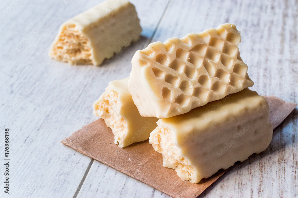 White Chocolate Wafer on wooden surface. White Chocolate Wafer on wooden surface.