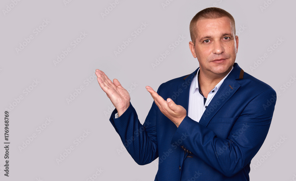 Businessman pointing to copy space Businessman pointing to copy space