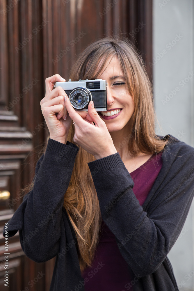 young woman taking a picture