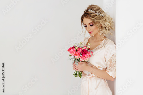 Portrait of beautiful bride. Blonde girl with curly hair and fashion makeup.