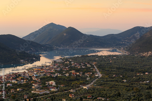 Morning view of Nydri village on Lefkada island with Ithaca and Kefalonia in the distance, Greece. 